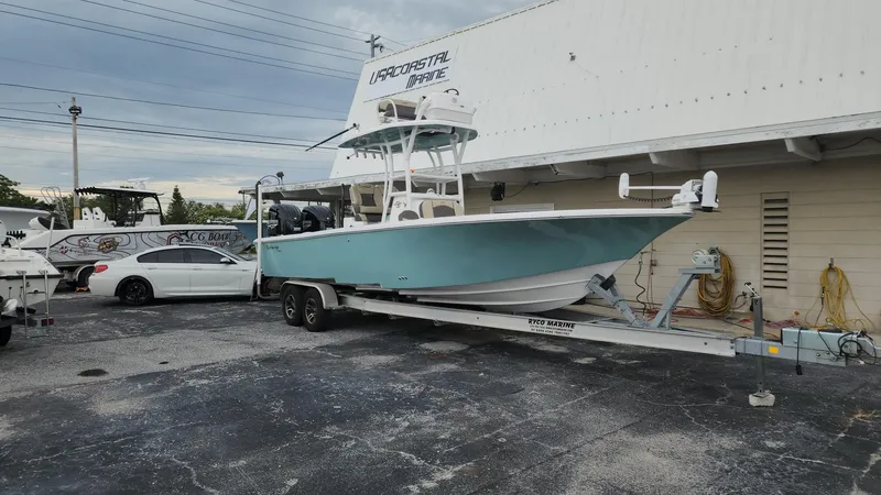 Slide: The Image of 2024 Tidewater 2700 Carolina Bay boat on trailer at marina. - 41