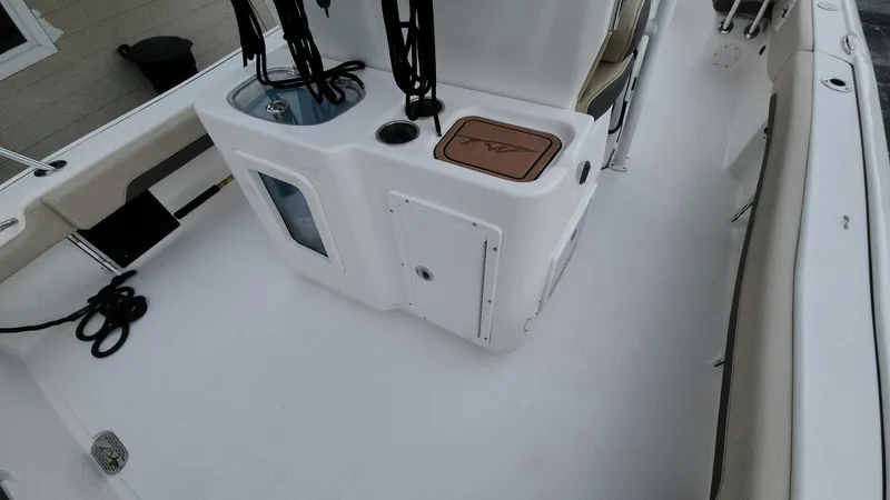 Slide: The Image of 2024 Tidewater 2700 Carolina Bay boat interior with seating and storage compartments. - 43