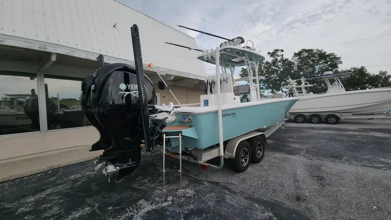 Slide: The Image of 2024 Tidewater 2700 Carolina Bay boat on trailer, featuring Yamaha outboard motor. - 47