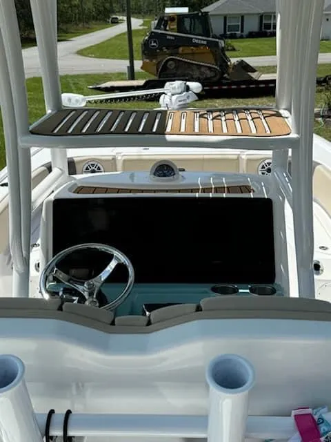 Slide: The Image of 2024 Tidewater 2700 Carolina Bay boat interior with steering wheel and console. - 5