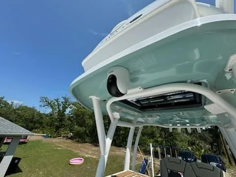 Slide: The Image of 2024 Tidewater 2700 Carolina Bay boat with T-top and outdoor seating. - 6