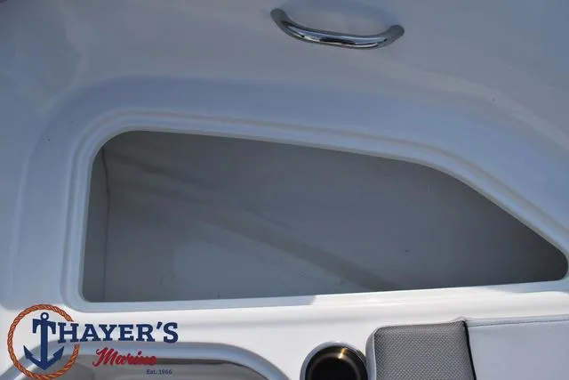 Slide: The Image of 2025 Bayliner VR5 Bowrider storage compartment with Thayer's Marine logo. - 14