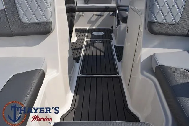 Slide: The Image of 2025 Bayliner VR5 Bowrider interior with sleek seating and flooring design. - 17