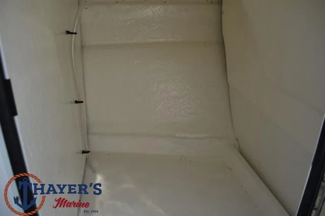 Slide: The Image of 2025 Bayliner VR5 Bowrider storage compartment, spacious and clean interior. - 19