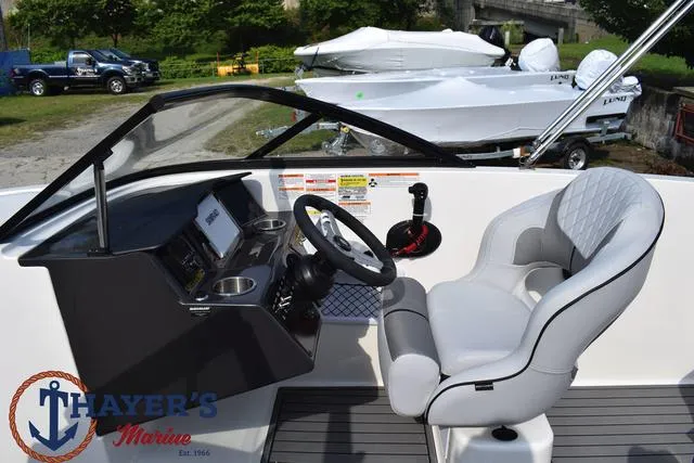 Slide: The Image of 2025 Bayliner VR5 Bowrider cockpit with steering wheel and captain's chair. - 27