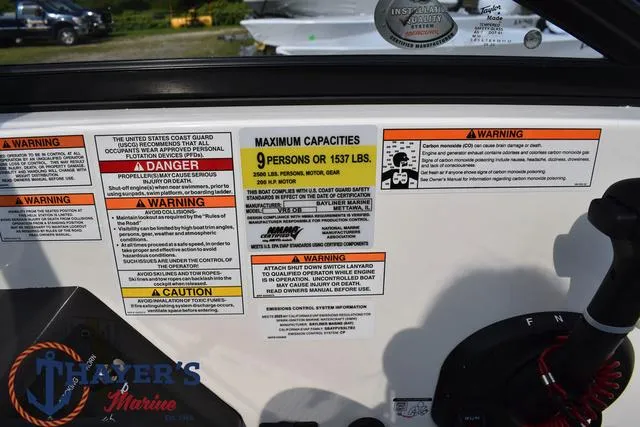 Slide: The Image of Warning labels on 2025 Bayliner VR5 Bowrider boat, maximum capacity 9 persons or 1537 lbs. - 29