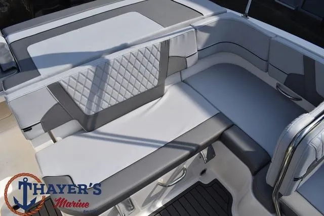 Slide: The Image of 2025 Bayliner VR5 Bowrider Outboard interior seating with modern design and Thayer's Marine logo. - 35