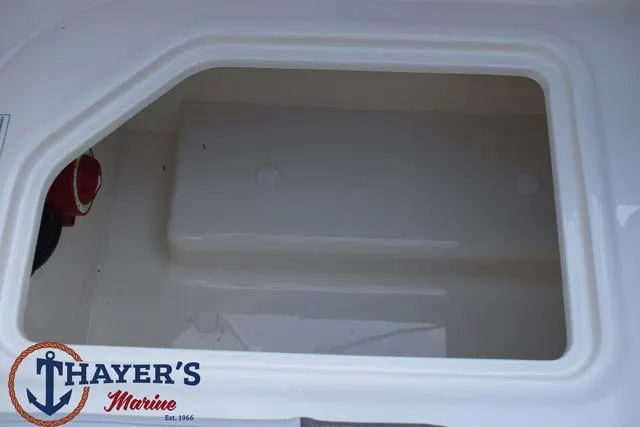 Slide: The Image of 2025 Bayliner VR5 Bowrider storage compartment, Thayer's Marine branding visible. - 37