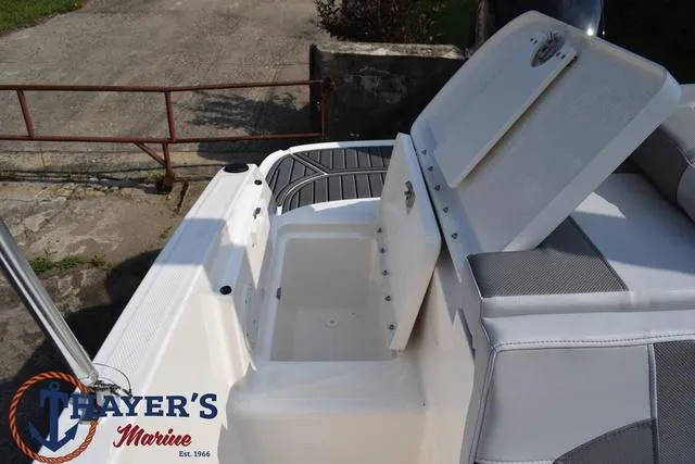 Slide: The Image of 2025 Bayliner VR5 Bowrider Outboard with open storage compartment, showcased by Hayer's Marine. - 41