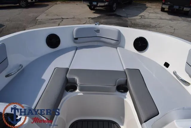 Slide: The Image of 2025 Bayliner VR5 Bowrider Outboard interior with seating and cup holders. - 9