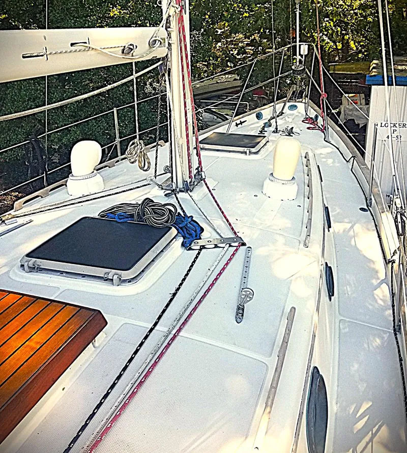 Slide: The Image of 1983 Pacific Seacraft Crealock 37 sailboat deck with rigging and hatches. - 7