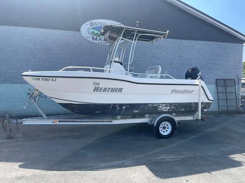 Slide: The Image of 2007 ProKat CS200 boat on trailer, parked outdoors, side view. - 1