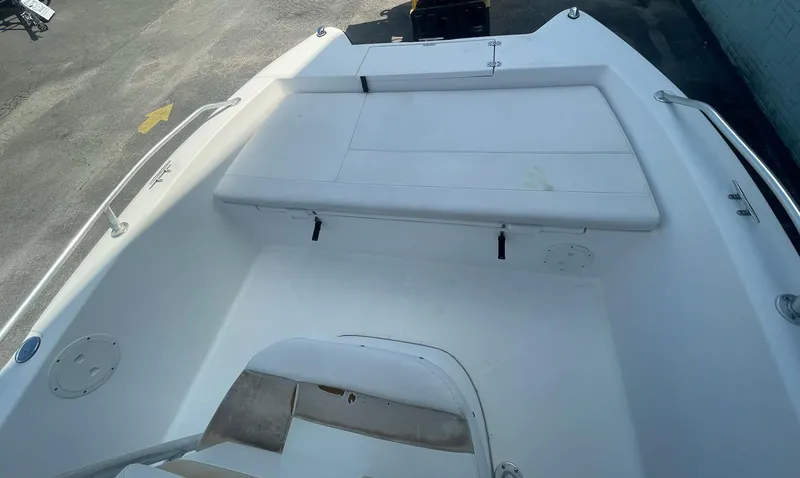 Slide: The Image of 2007 ProKat CS200 boat interior with white seating and storage area. - 7