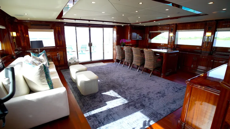 Slide: The Image of Luxurious interior of 2010 Horizon 136 Premier yacht with elegant seating and rich wood finishes. - 13