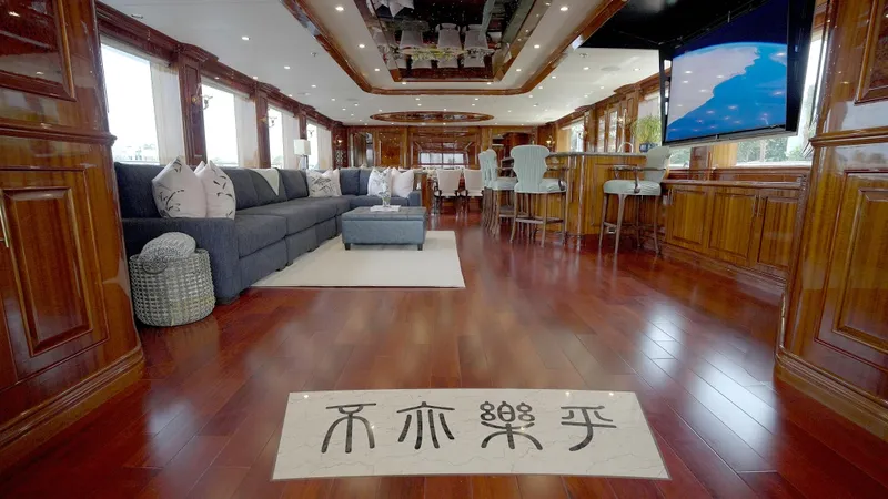 Slide: The Image of Luxurious interior of 2010 Horizon 136 Premier yacht with elegant wood finishes and plush seating. - 21