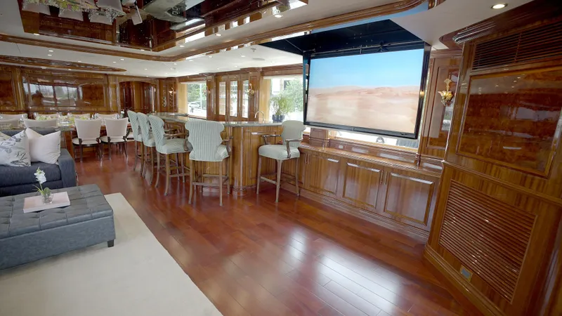Slide: The Image of Luxurious interior of 2010 Horizon 136 Premier yacht with elegant wood finishes and seating area. - 24