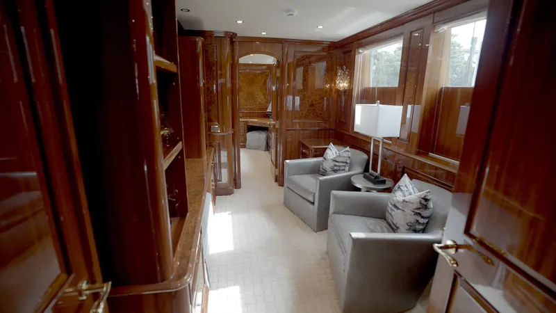 Slide: The Image of Luxurious interior of 2010 Horizon 136 Premier yacht with polished wood and plush seating. - 28