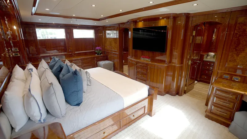 Slide: The Image of Luxurious bedroom interior of 2010 Horizon 136 Premier yacht with elegant wood finishes. - 29