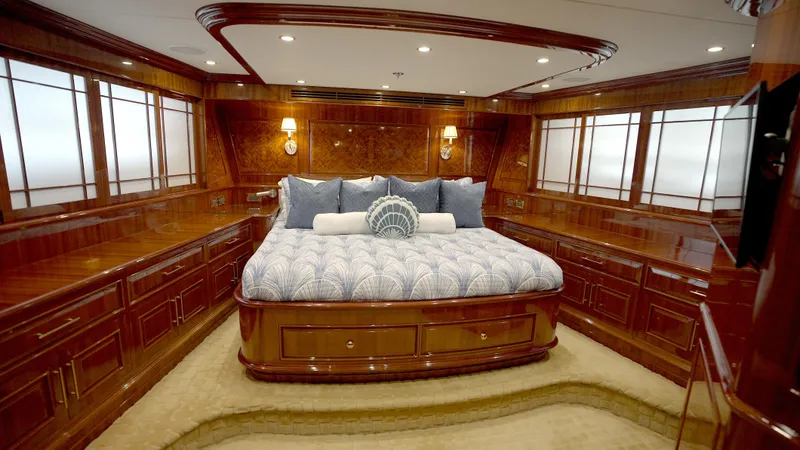 Slide: The Image of Luxurious bedroom in 2010 Horizon 136 Premier yacht with elegant wood paneling and plush bedding. - 39