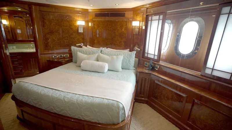 Slide: The Image of Luxurious bedroom interior of 2010 Horizon 136 Premier yacht with elegant wood paneling. - 42