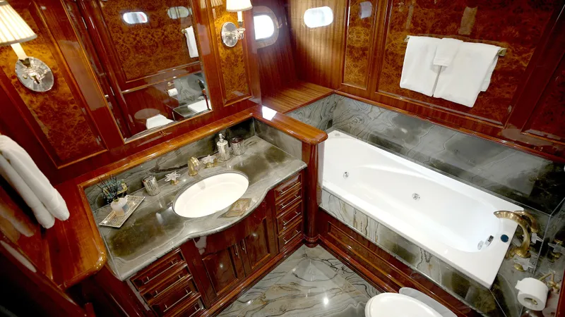 Slide: The Image of Luxurious yacht bathroom with marble countertops and a bathtub, Horizon 136 Premier, 2010 model. - 43