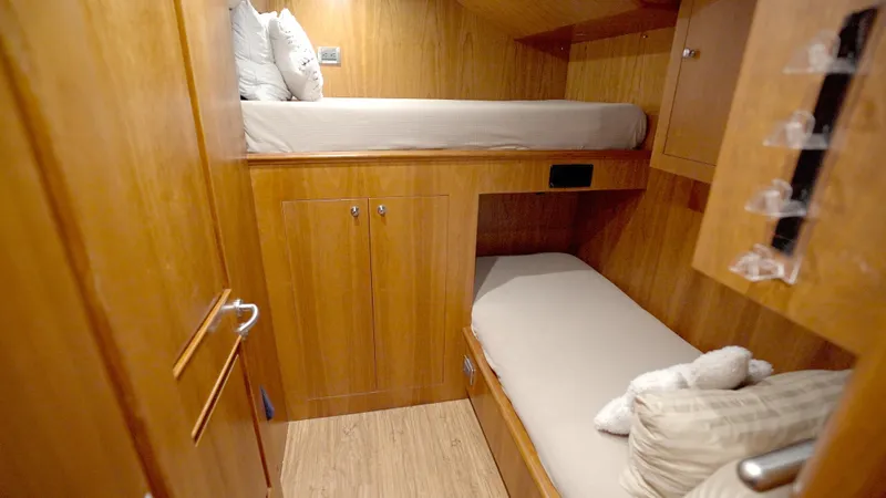 Slide: The Image of Cozy wooden cabin with bunk beds in 2010 Horizon 136 Premier yacht. - 49