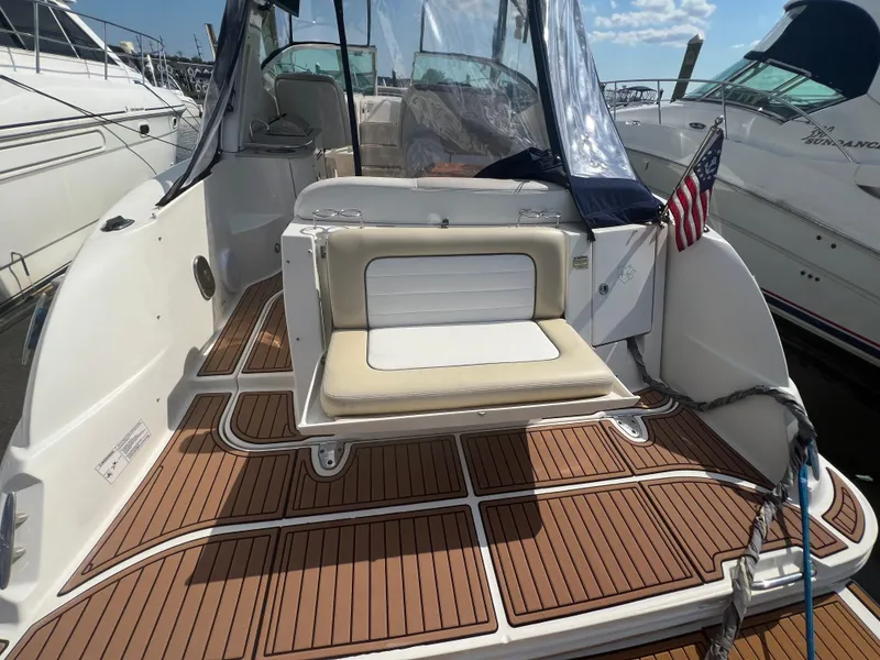 Slide: The Image of 2010 Sea Ray 350 Sundancer boat with teak deck and seating area. - 13