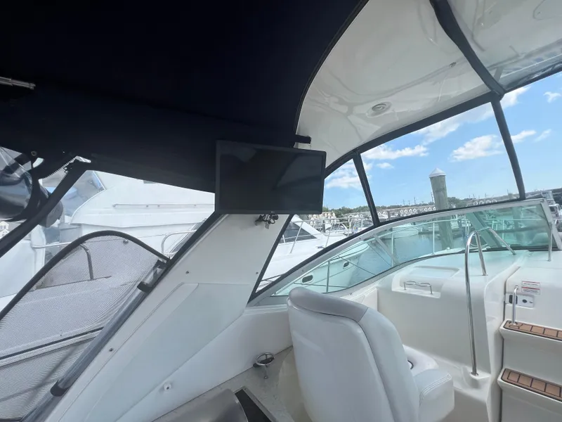 Slide: The Image of Interior view of 2010 Sea Ray 350 Sundancer yacht with seating and navigation equipment. - 17