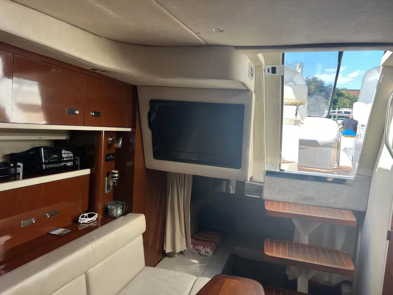 Slide: The Image of Interior of 2010 Sea Ray 350 Sundancer yacht with TV and seating area. - 27