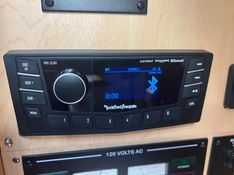 Slide: The Image of Rockford Fosgate stereo system on 2010 Sea Ray 350 Sundancer boat dashboard. - 30