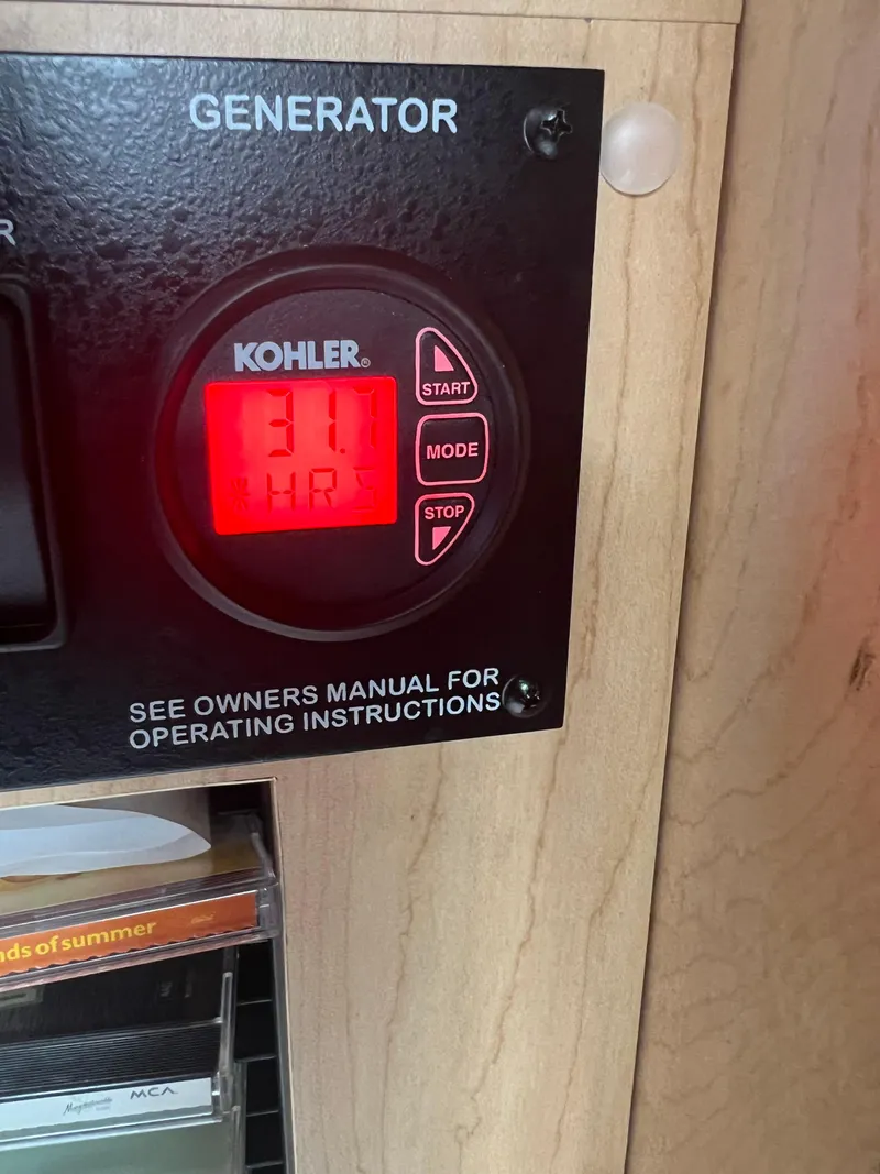 Slide: The Image of Kohler generator display showing 31 hours on a 2010 Sea Ray 350 Sundancer. - 31