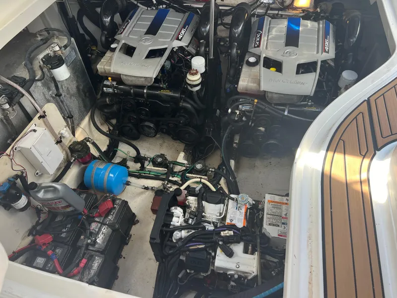 Slide: The Image of Engine compartment of 2010 Sea Ray 350 Sundancer with dual engines and equipment. - 34