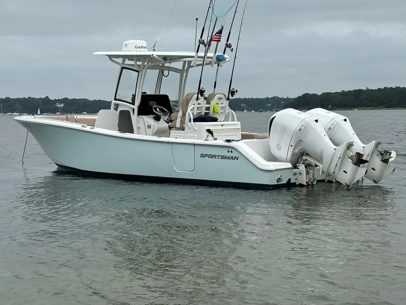 The Image of 2019 Sportsman 282 boat with dual engines on calm water. - 0