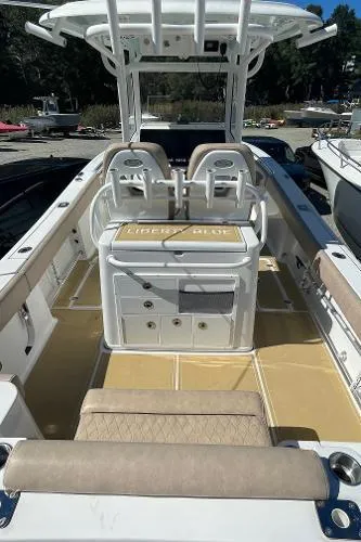 Slide: The Image of 2019 Sportsman 282 boat with dual seats, spacious deck, and modern design. - 10