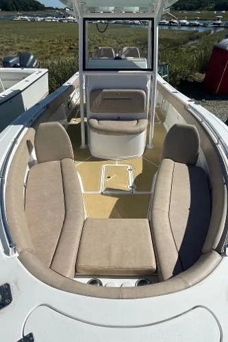 Slide: The Image of 2019 Sportsman 282 boat interior with beige seating and open deck. - 5