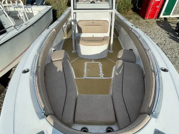 Slide: The Image of 2019 Sportsman 282 boat interior with beige seating and spacious deck layout. - 6