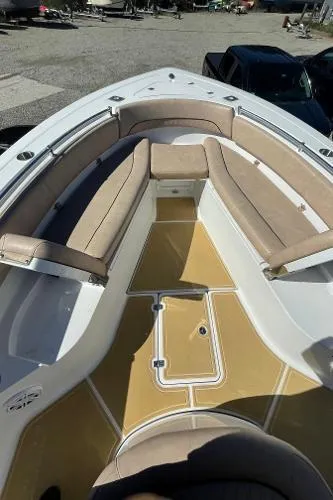 Slide: The Image of 2019 Sportsman 282 boat interior with beige seating and spacious deck. - 8