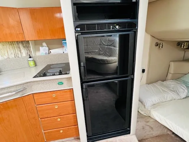 Slide: The Image of Interior of a 2000 Formula 41 PC yacht with kitchen and sleeping area. - 11