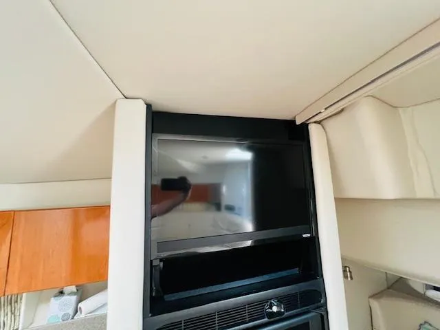 Slide: The Image of Interior of a 2000 Formula 41 PC yacht featuring a mounted Vizio TV. - 16