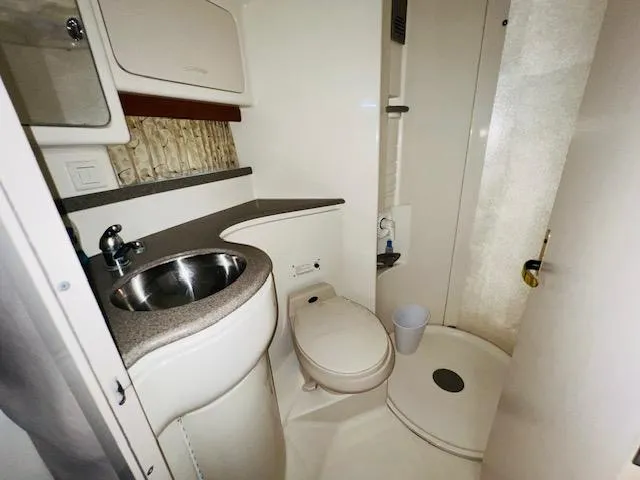 Slide: The Image of 2000 Formula 41 PC yacht bathroom with sink, toilet, and shower. - 18