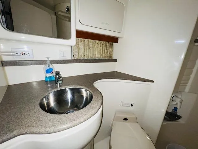 Slide: The Image of 2000 Formula 41 PC yacht bathroom with sink, countertop, and toilet. - 19