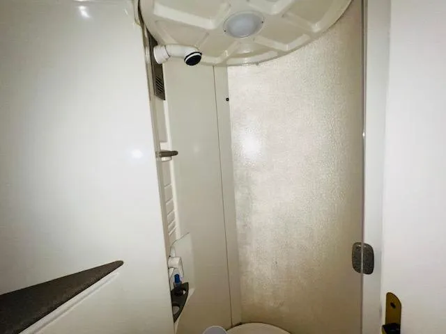 Slide: The Image of Interior of a 2000 Formula 41 PC boat bathroom with shower and fixtures. - 20