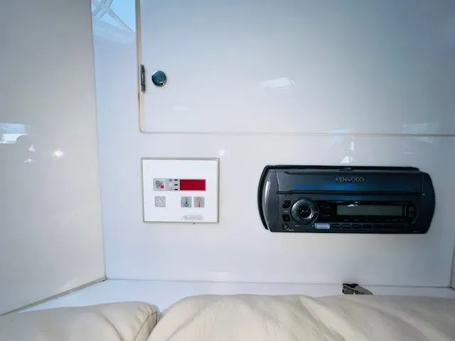 Slide: The Image of Control panel and Kenwood stereo in 2000 Formula 41 PC boat interior. - 23
