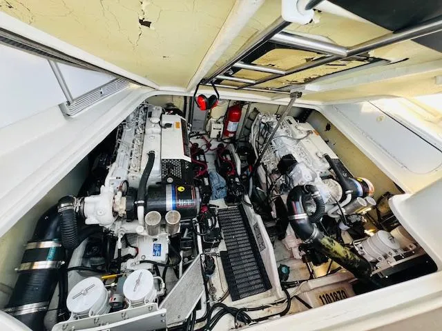 Slide: The Image of Engine compartment of a 2000 Formula 41 PC boat, showcasing dual engines and equipment. - 29