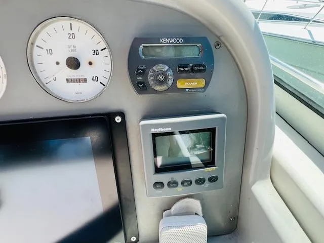 Slide: The Image of Control panel of a 2000 Formula 41 PC boat with Kenwood and Raytheon devices. - 3