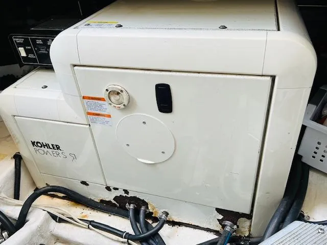 Slide: The Image of Kohler generator in a 2000 Formula 41 PC boat, showing control panel and wiring. - 30