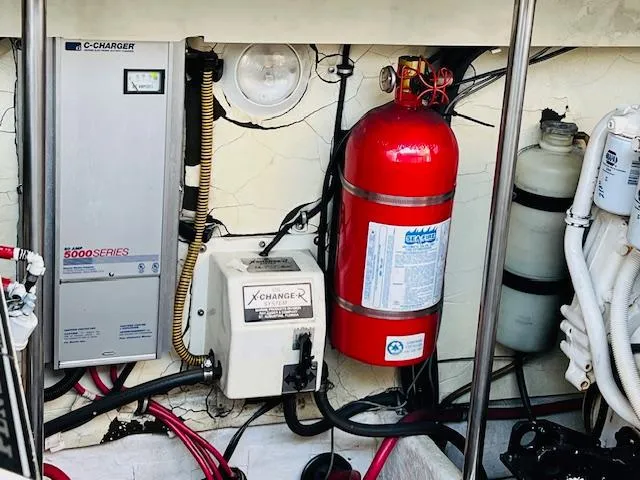 Slide: The Image of Engine compartment of 2000 Formula 41 PC with fire extinguisher and electrical components. - 32