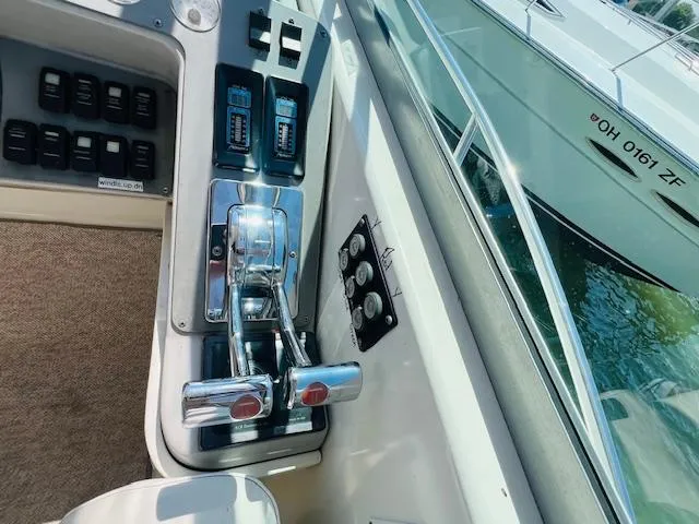 Slide: The Image of Control panel of a 2000 Formula 41 PC boat, featuring throttle levers and switches. - 4