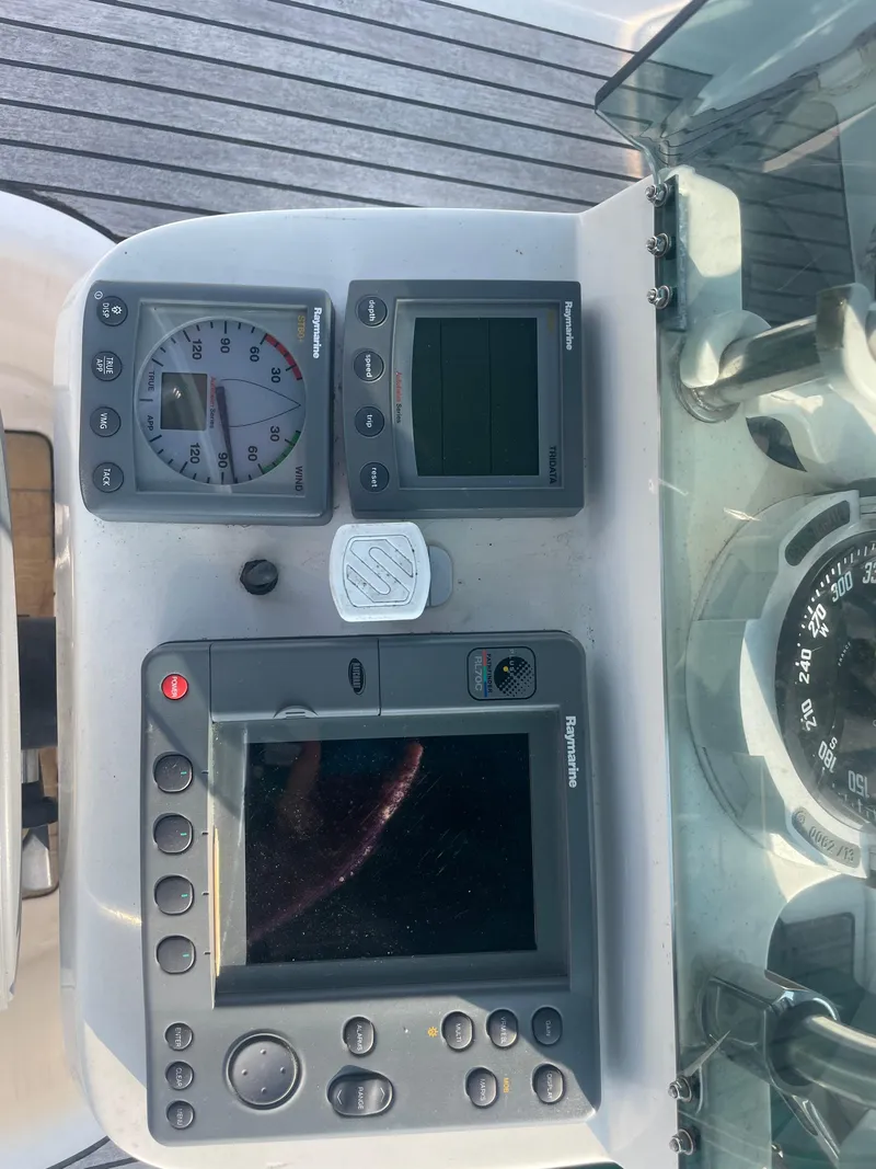 Slide: The Image of Control panel of a 1999 Beneteau Oceanis 36 CC sailboat with navigation instruments. - 7