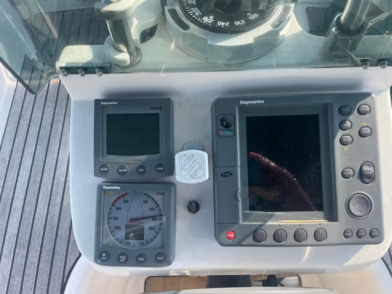 Slide: The Image of Control panel of a 1999 Beneteau Oceanis 36 CC sailboat with navigation instruments. - 8